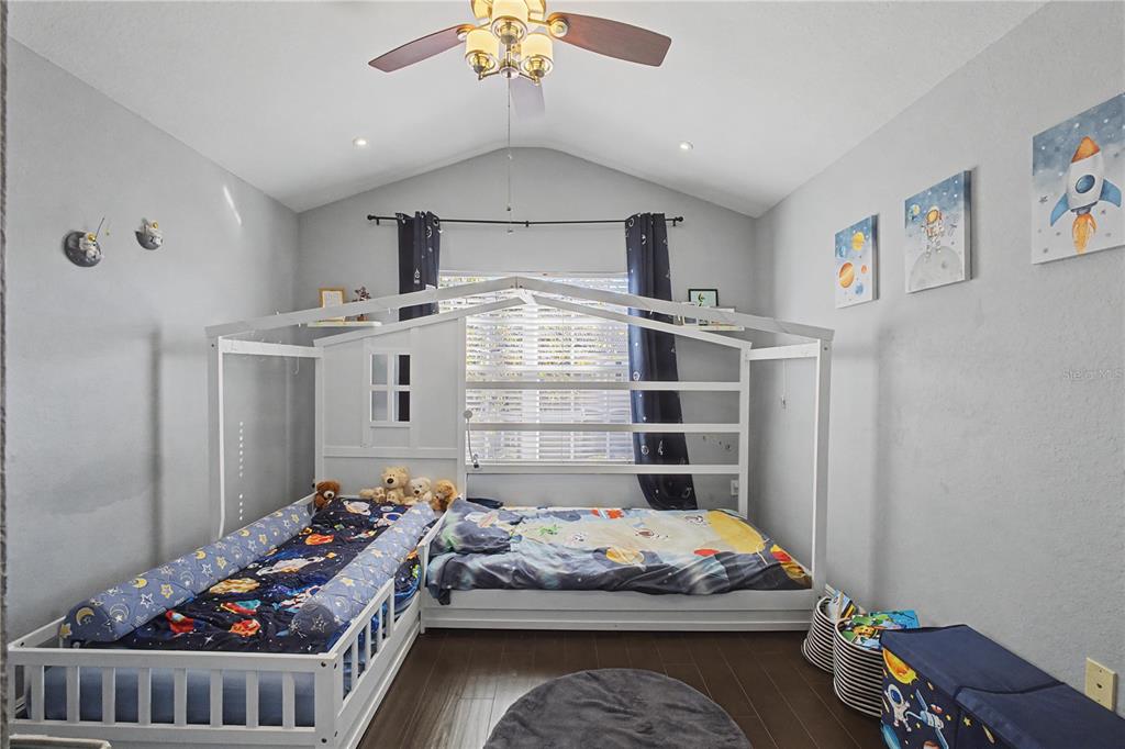 6435 Ranelagh Drive, Unit 104 Orlando, FL 32835 - Photo 24 of 36 a bed room with a bed and a window