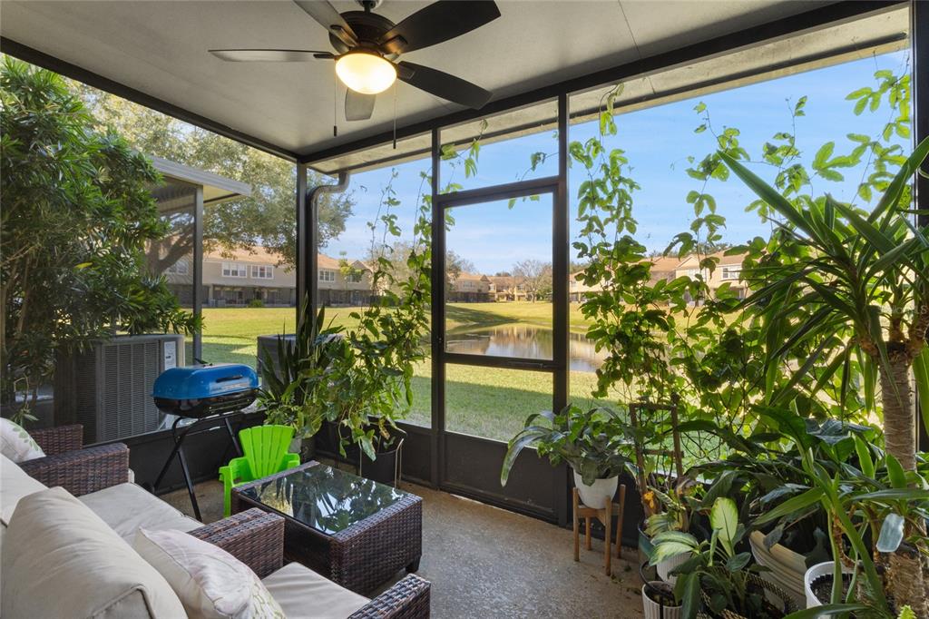 6435 Ranelagh Drive, Unit 104 Orlando, FL 32835 - Photo 26 of 36 a living room with furniture and a potted plant