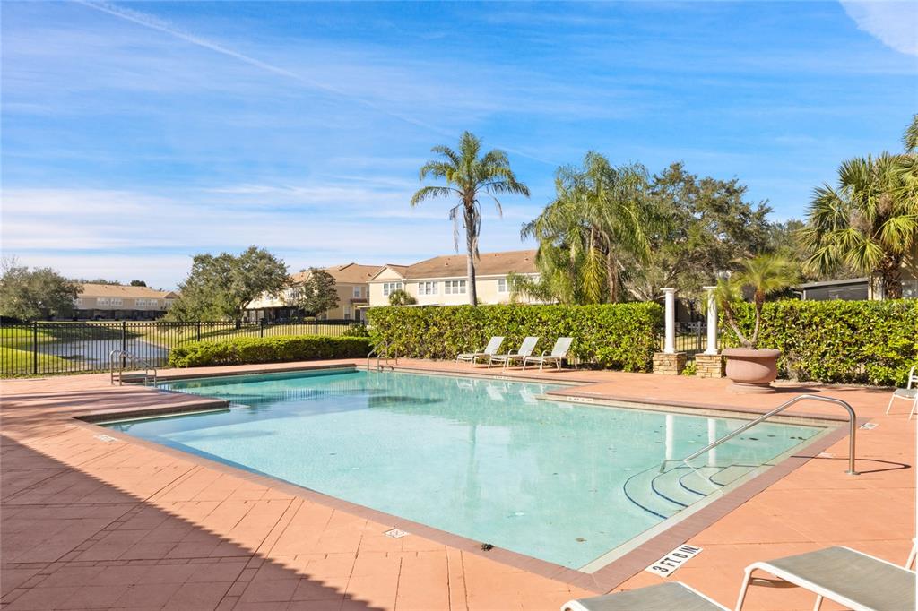 6435 Ranelagh Drive, Unit 104 Orlando, FL 32835 - Photo 34 of 36 a view of a swimming pool and an outdoor seating