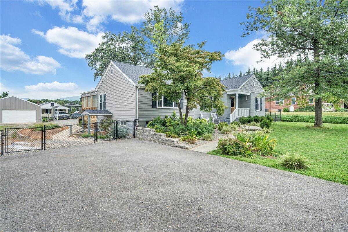 423 Turner Road Salem, VA 24153 - Photo 1 of 67 a view of a house with a garden and pathway