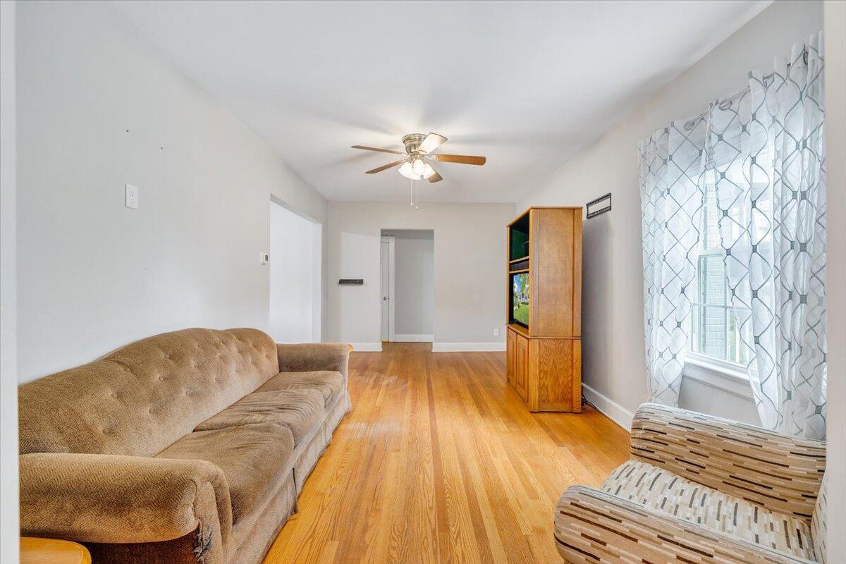423 Turner Road Salem, VA 24153 - Photo 11 of 67 a living room with a couch and a chandelier