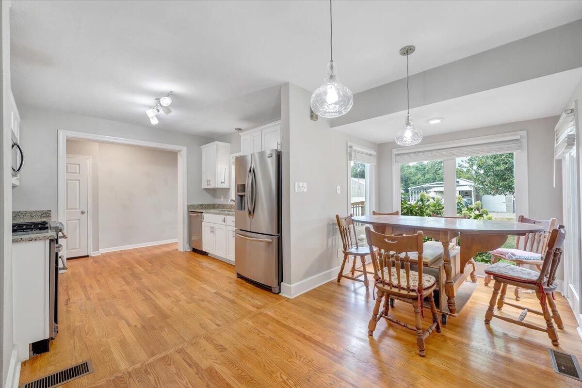 423 Turner Road Salem, VA 24153 - Photo 14 of 67 a kitchen with stainless steel appliances a dining table chairs refrigerator and microwave