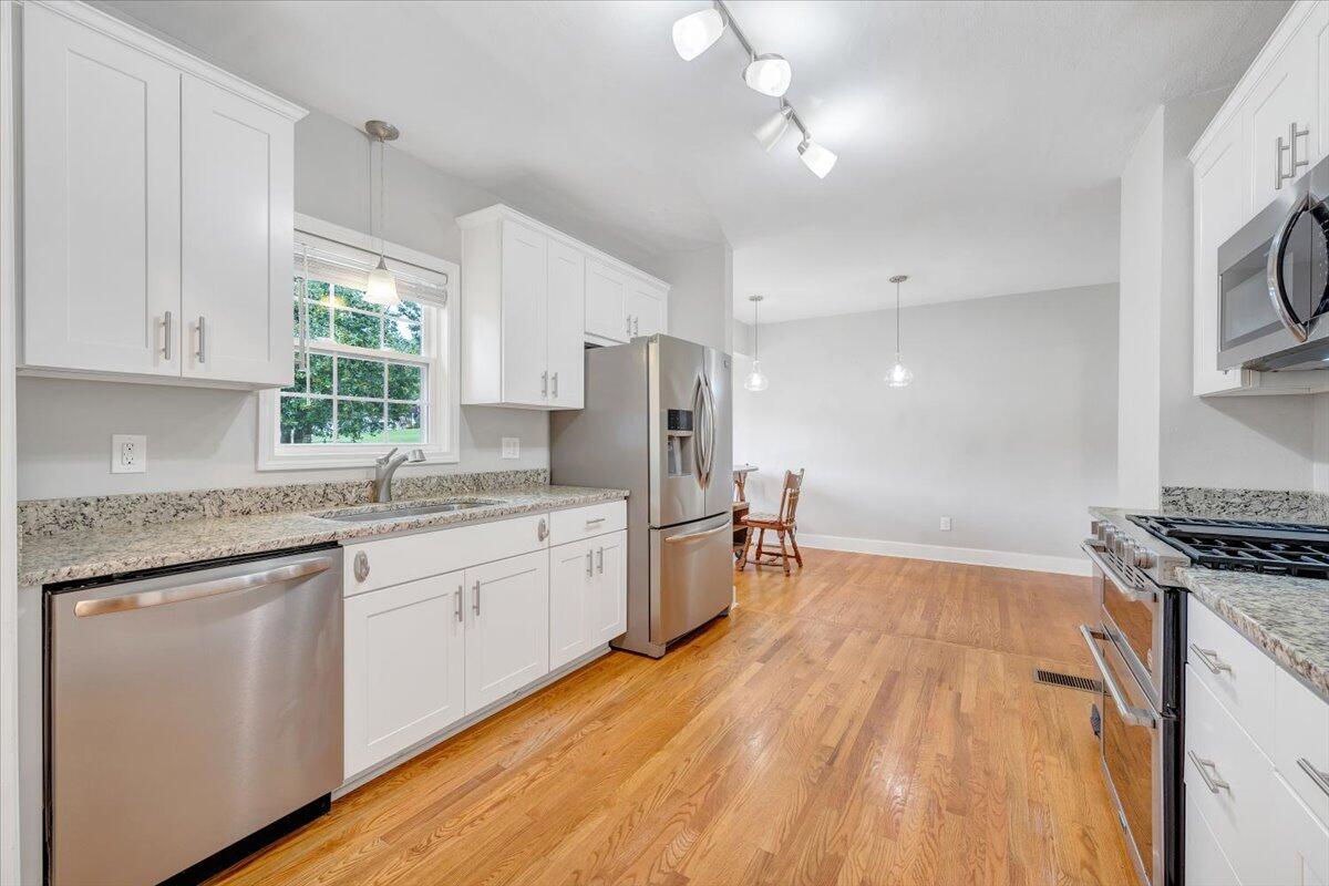 423 Turner Road Salem, VA 24153 - Photo 20 of 67 a kitchen with a sink a window stainless steel appliances and cabinets