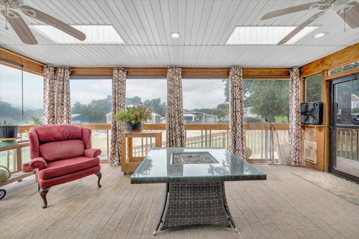 423 Turner Road Salem, VA 24153 - Photo 25 of 67 a living room with furniture and a floor to ceiling window