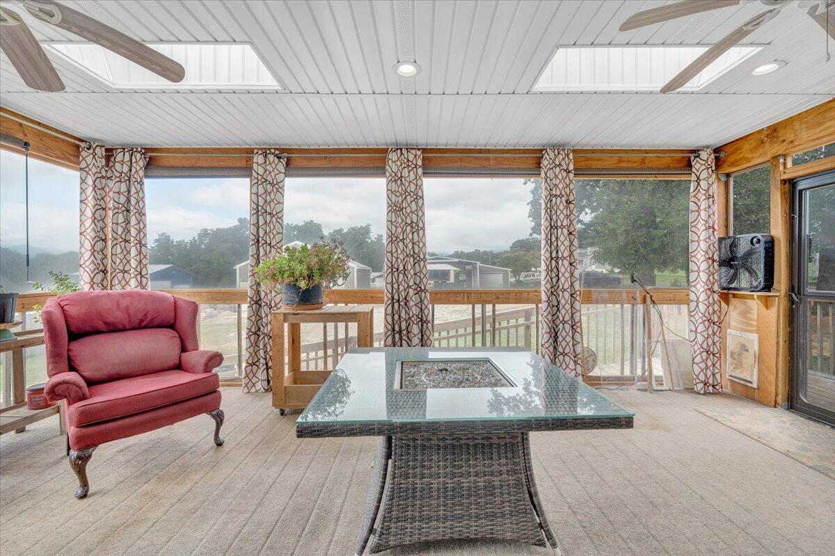423 Turner Road Salem, VA 24153 - Photo 26 of 67 a living room with furniture and a floor to ceiling window