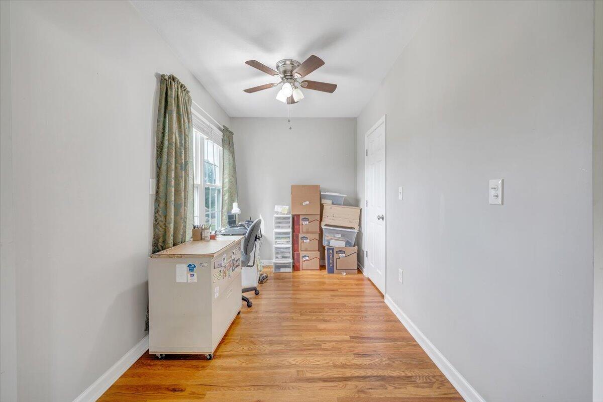 423 Turner Road Salem, VA 24153 - Photo 33 of 67 a view of a bedroom with wooden floor and fan