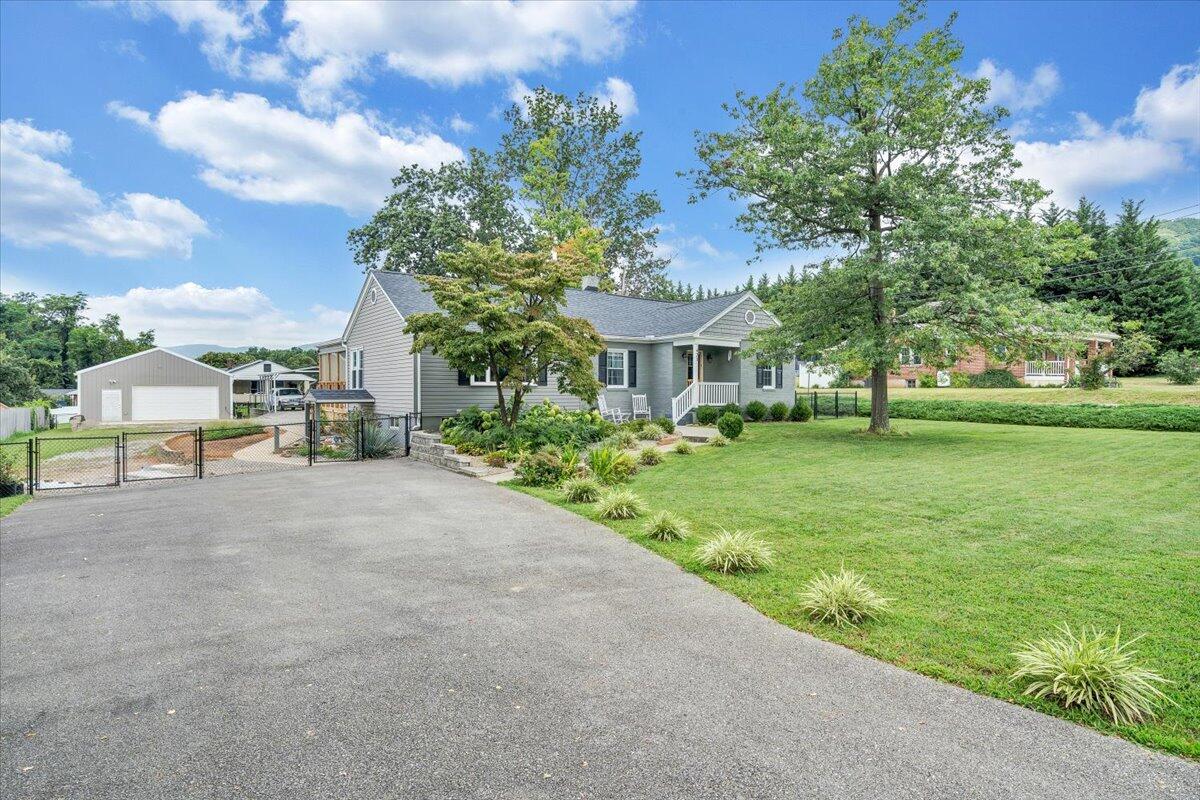 423 Turner Road Salem, VA 24153 - Photo 50 of 67 a view of a house with a yard and potted plants