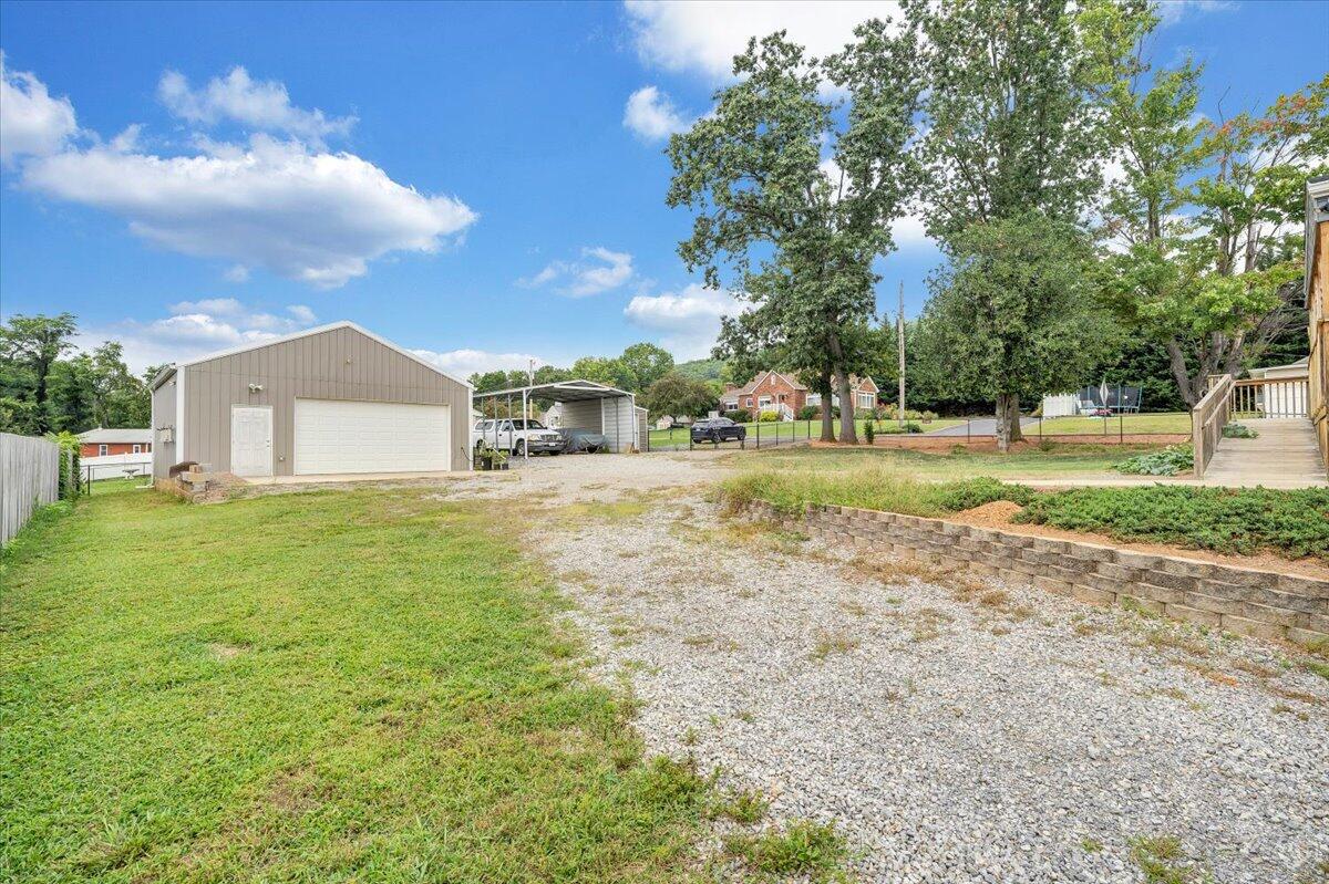 423 Turner Road Salem, VA 24153 - Photo 55 of 67 a view of a big yard with large trees and a small yard