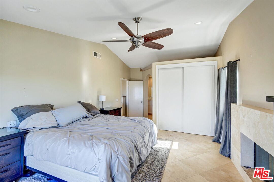 2868 Rutgers Place Oceanside, CA 92056 - Photo 17 of 34 a bedroom with a bed and a ceiling fan