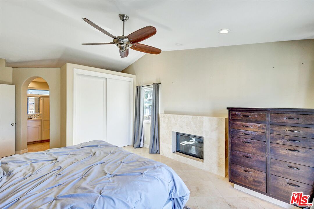 2868 Rutgers Place Oceanside, CA 92056 - Photo 18 of 34 a bedroom with a bed and a fireplace