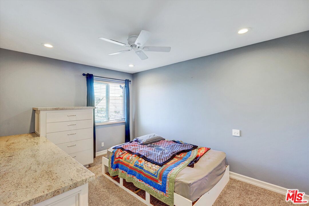 2868 Rutgers Place Oceanside, CA 92056 - Photo 25 of 34 a bedroom with a bed and a dresser