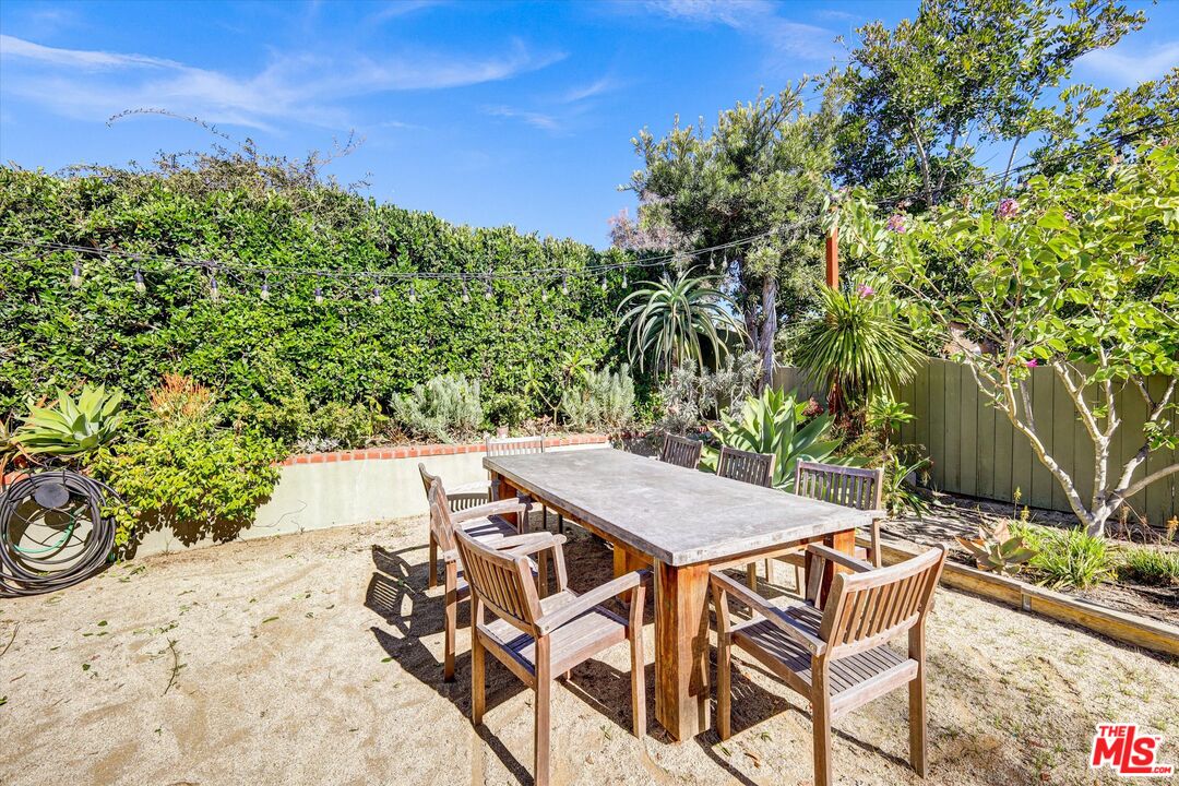 2868 Rutgers Place Oceanside, CA 92056 - Photo 31 of 34 a patio with table and chairs and potted plants