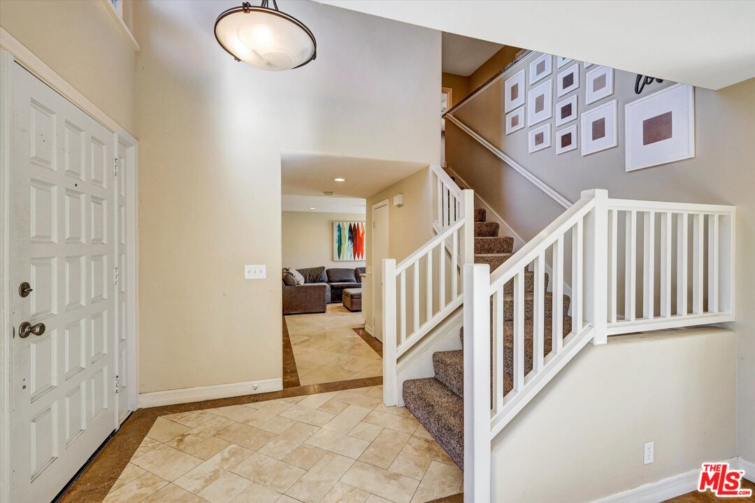 2868 Rutgers Place Oceanside, CA 92056 - Photo 5 of 34 a view of a hallway with windows and entryway