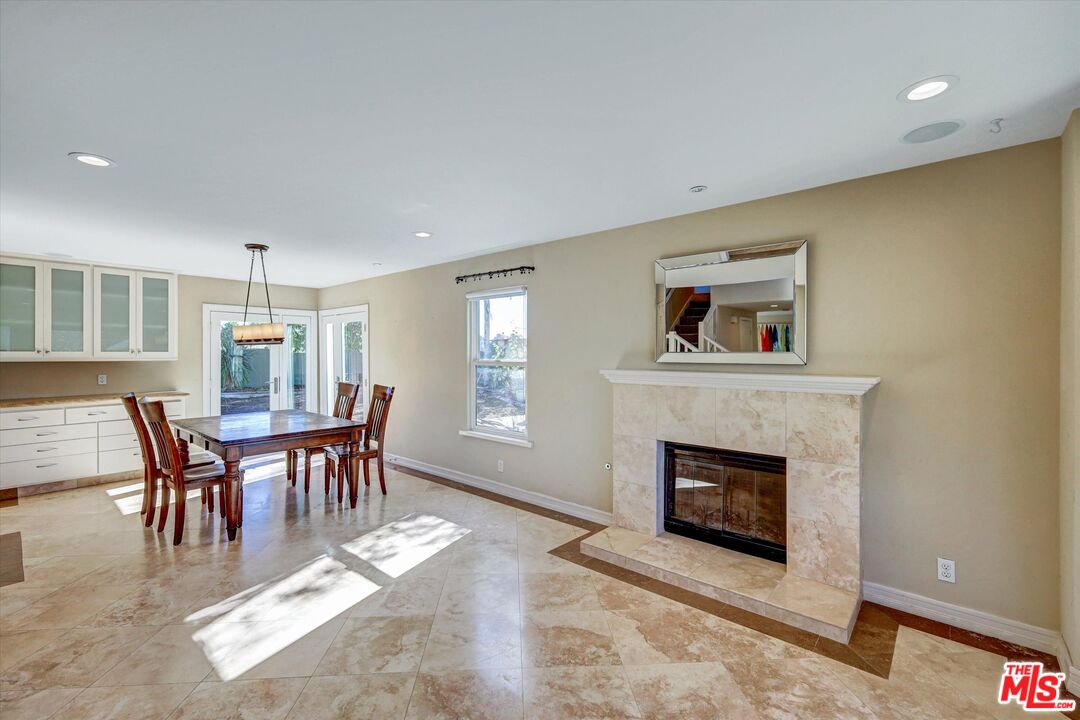 2868 Rutgers Place Oceanside, CA 92056 - Photo 9 of 34 a living room with furniture a fireplace and a table