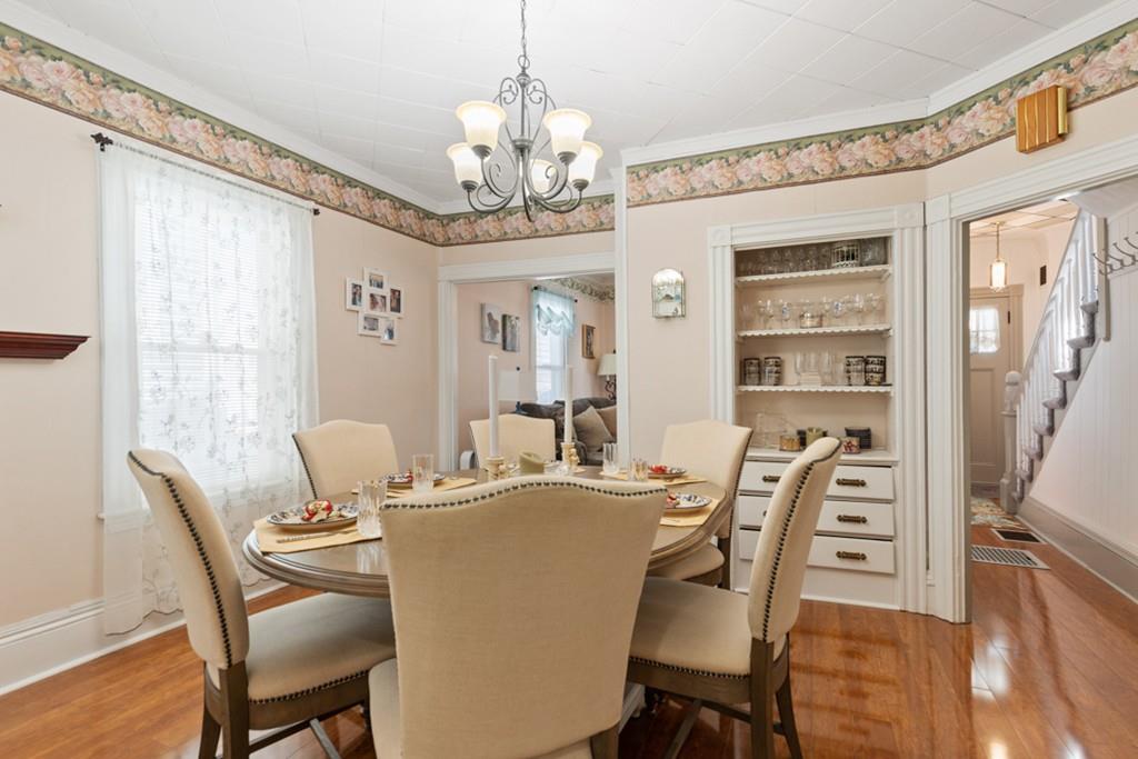 37 Alpine Street Somerville, MA 02144 - Photo 11 of 31 a view of a dining room with furniture a chandelier and wooden floor