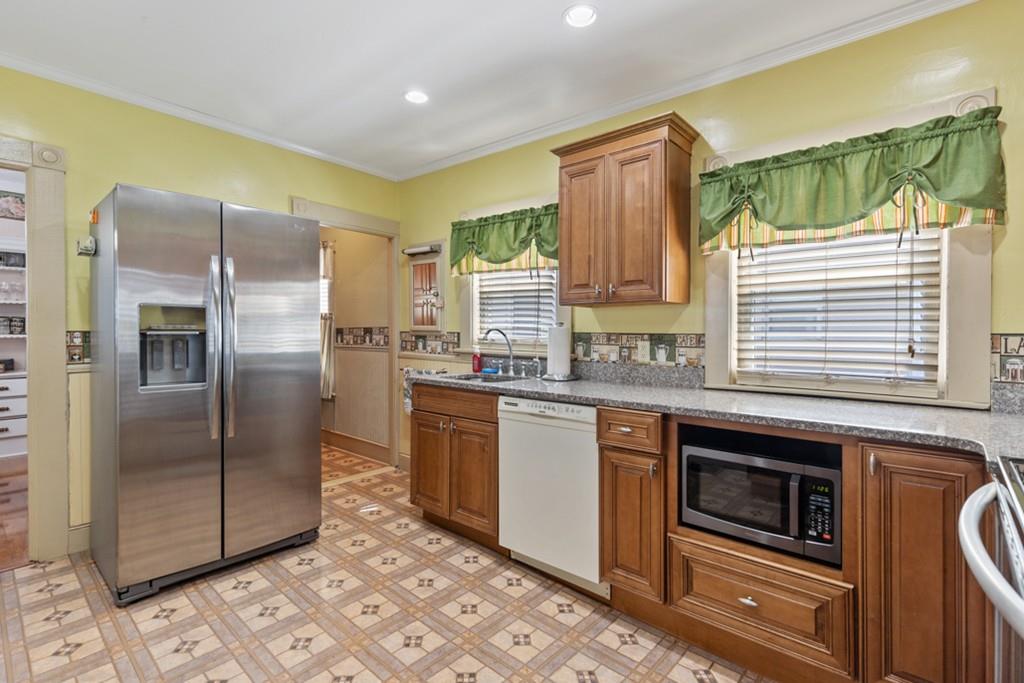 37 Alpine Street Somerville, MA 02144 - Photo 14 of 31 a kitchen with stainless steel appliances granite countertop a refrigerator and a stove