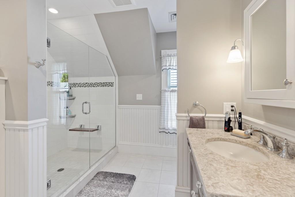 37 Alpine Street Somerville, MA 02144 - Photo 23 of 31 a bathroom with a tub sink and shower