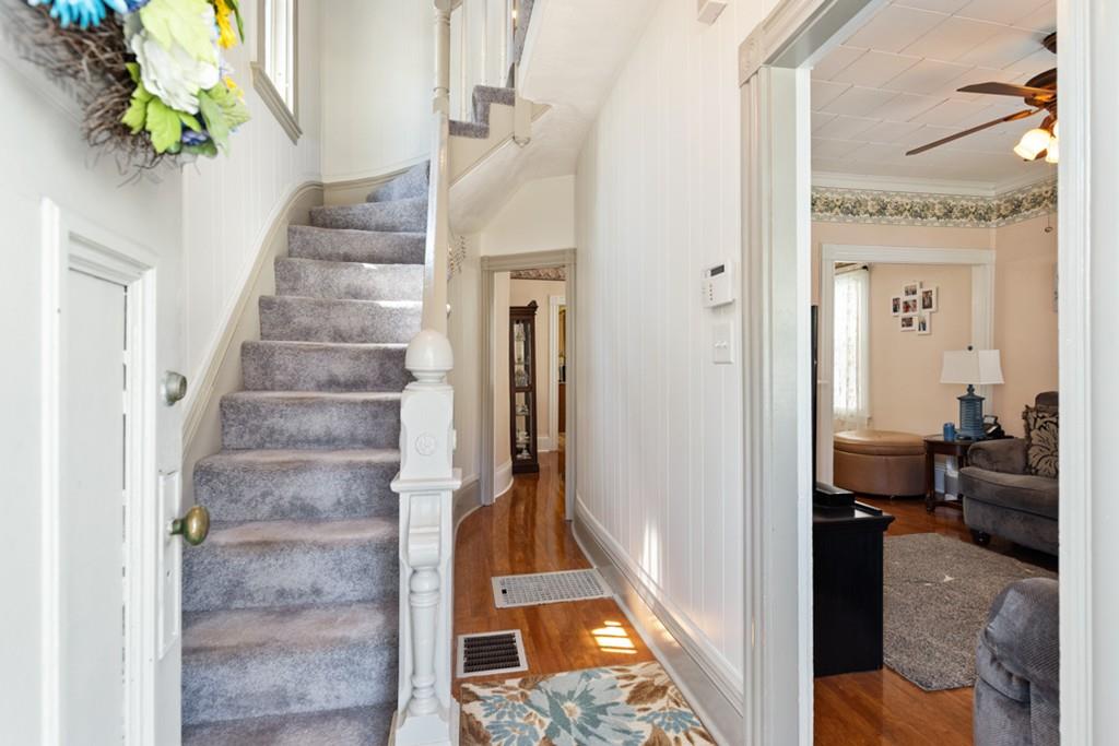 37 Alpine Street Somerville, MA 02144 - Photo 6 of 31 a view of a hallway with wooden floor and staircase