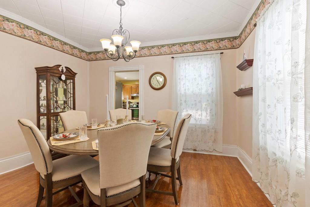 37 Alpine Street Somerville, MA 02144 - Photo 9 of 31 a view of a dining room with furniture a chandelier and wooden floor