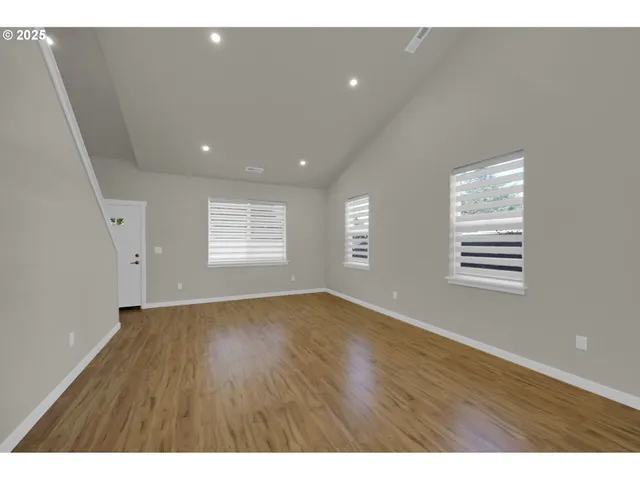 a view of kitchen with cabinets and wooden floor