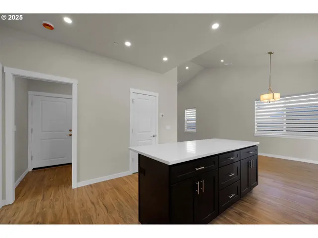 a kitchen with cabinets and window