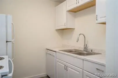 a bathroom with a sink and cabinets