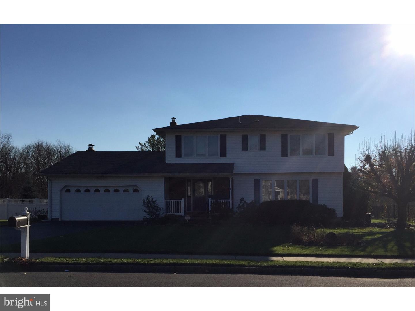 27 Peter Rafferty Drive Hamilton, NJ 08690 - Photo 1 of 15 a black white house with a yard in back