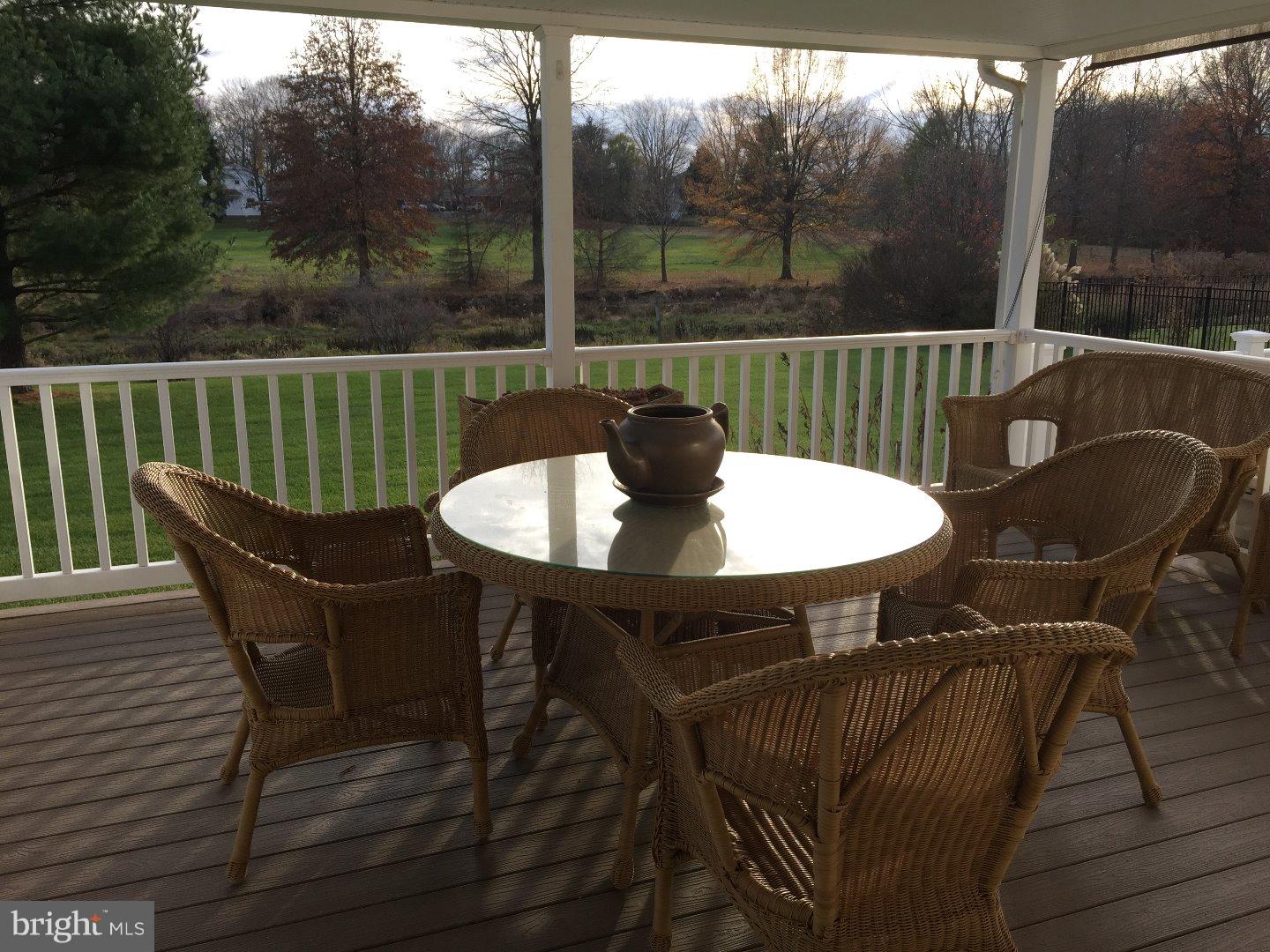 27 Peter Rafferty Drive Hamilton, NJ 08690 - Photo 13 of 15 a view of a chairs and table on the deck