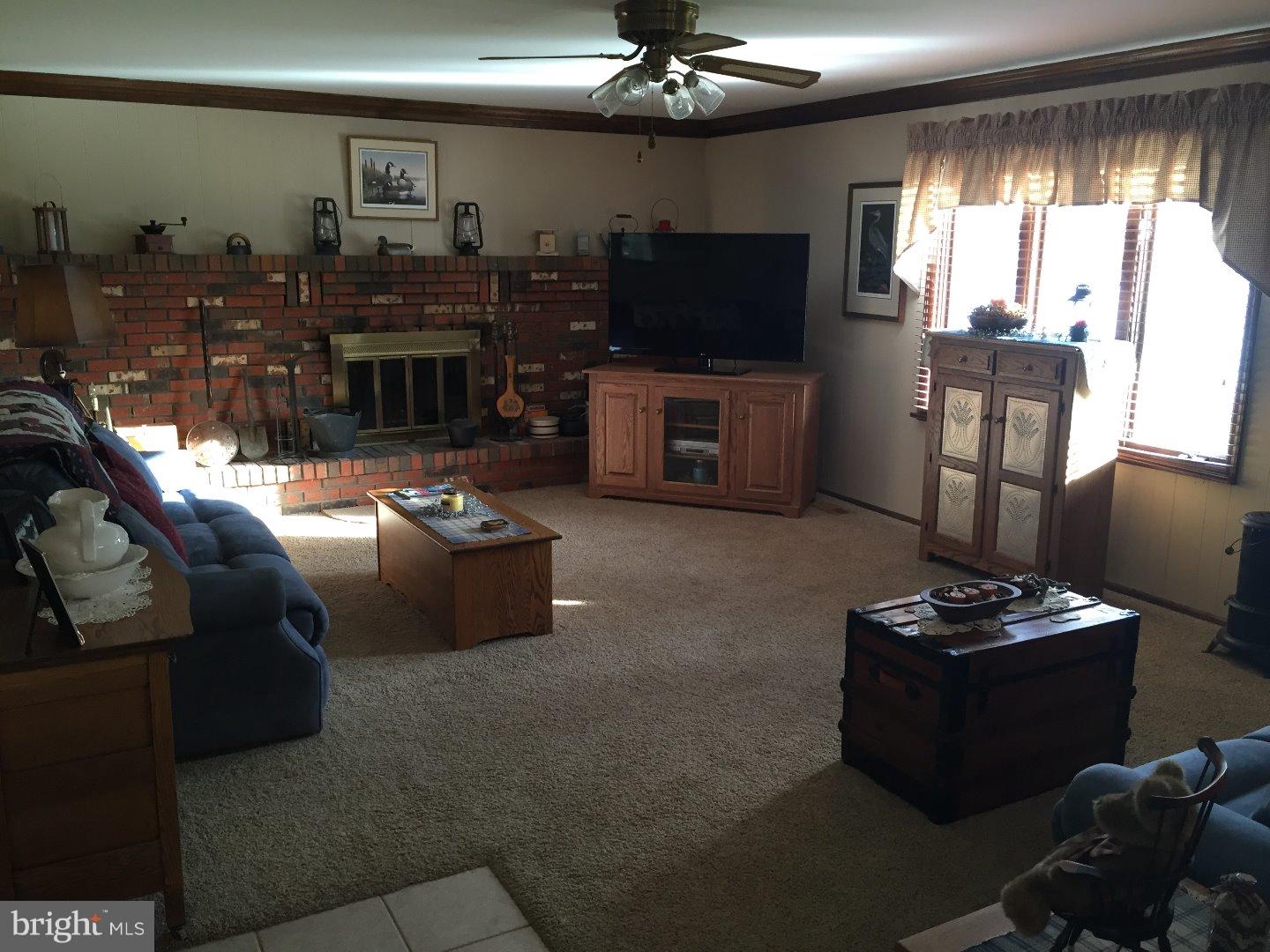 27 Peter Rafferty Drive Hamilton, NJ 08690 - Photo 6 of 15 a living room with furniture and a flat screen tv