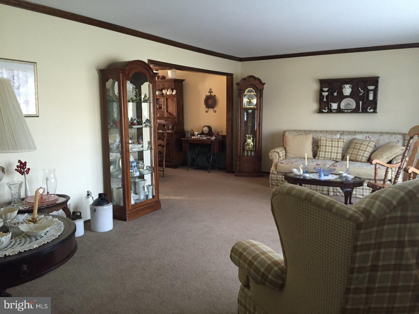 27 Peter Rafferty Drive Hamilton, NJ 08690 - Photo 7 of 15 a living room with furniture and a window