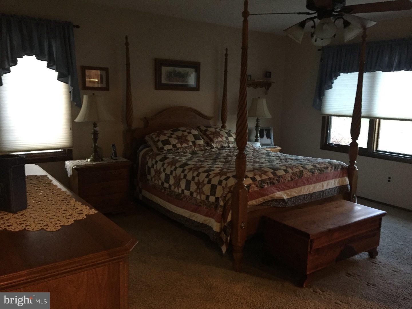 27 Peter Rafferty Drive Hamilton, NJ 08690 - Photo 9 of 15 a bed sitting in a bedroom next to a window