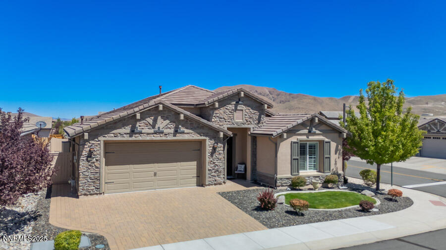 2295 Maximus Lane Reno, NV 89521 - Photo 1 of 62 a front view of a house with a yard