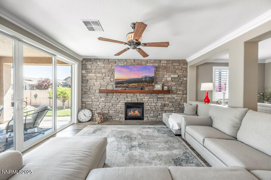 2295 Maximus Lane Reno, NV 89521 - Photo 15 of 62 a living room with furniture and a fireplace