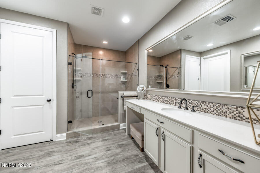 2295 Maximus Lane Reno, NV 89521 - Photo 19 of 62 a spacious bathroom with a shower a sink and a mirror