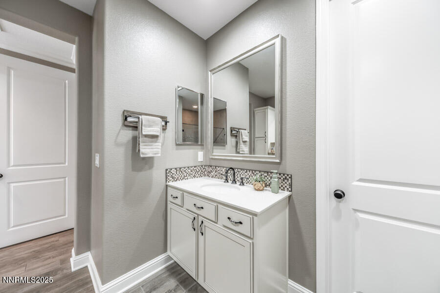 2295 Maximus Lane Reno, NV 89521 - Photo 20 of 62 a bathroom with a sink vanity and a mirror
