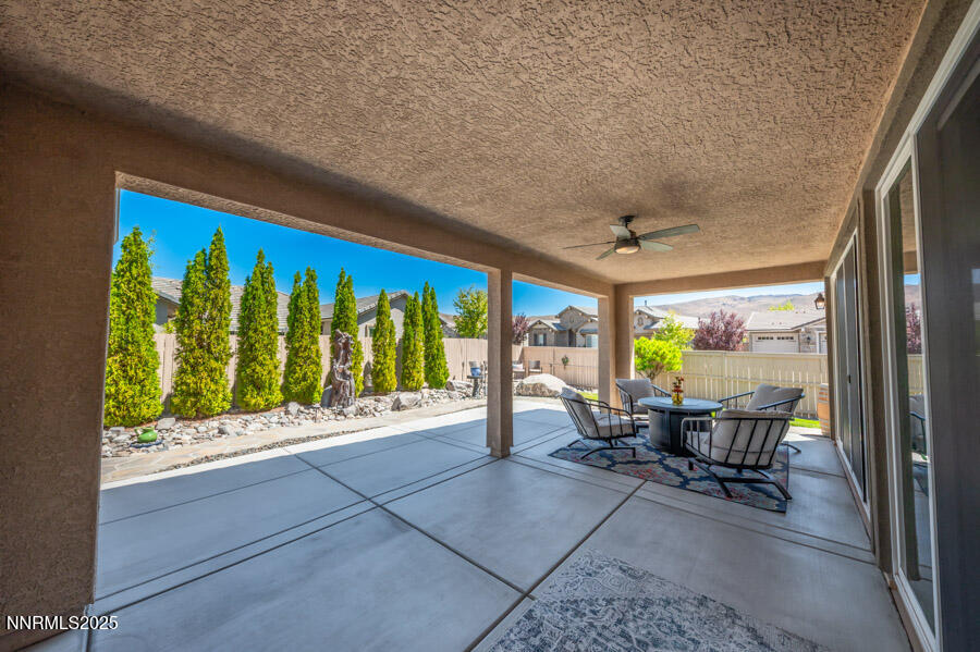 2295 Maximus Lane Reno, NV 89521 - Photo 27 of 62 a view of a patio with a dining table and chairs