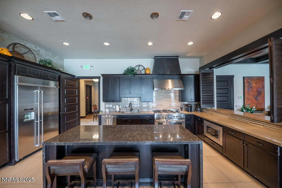 2295 Maximus Lane Reno, NV 89521 - Photo 40 of 62 a kitchen with counter space cabinets and appliances