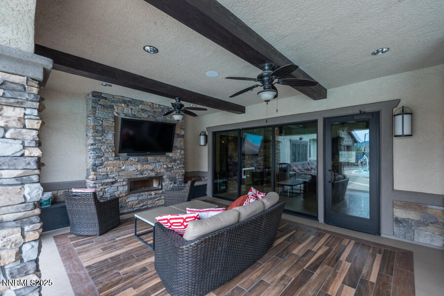2295 Maximus Lane Reno, NV 89521 - Photo 46 of 62 a living room with fireplace furniture and a flat screen tv