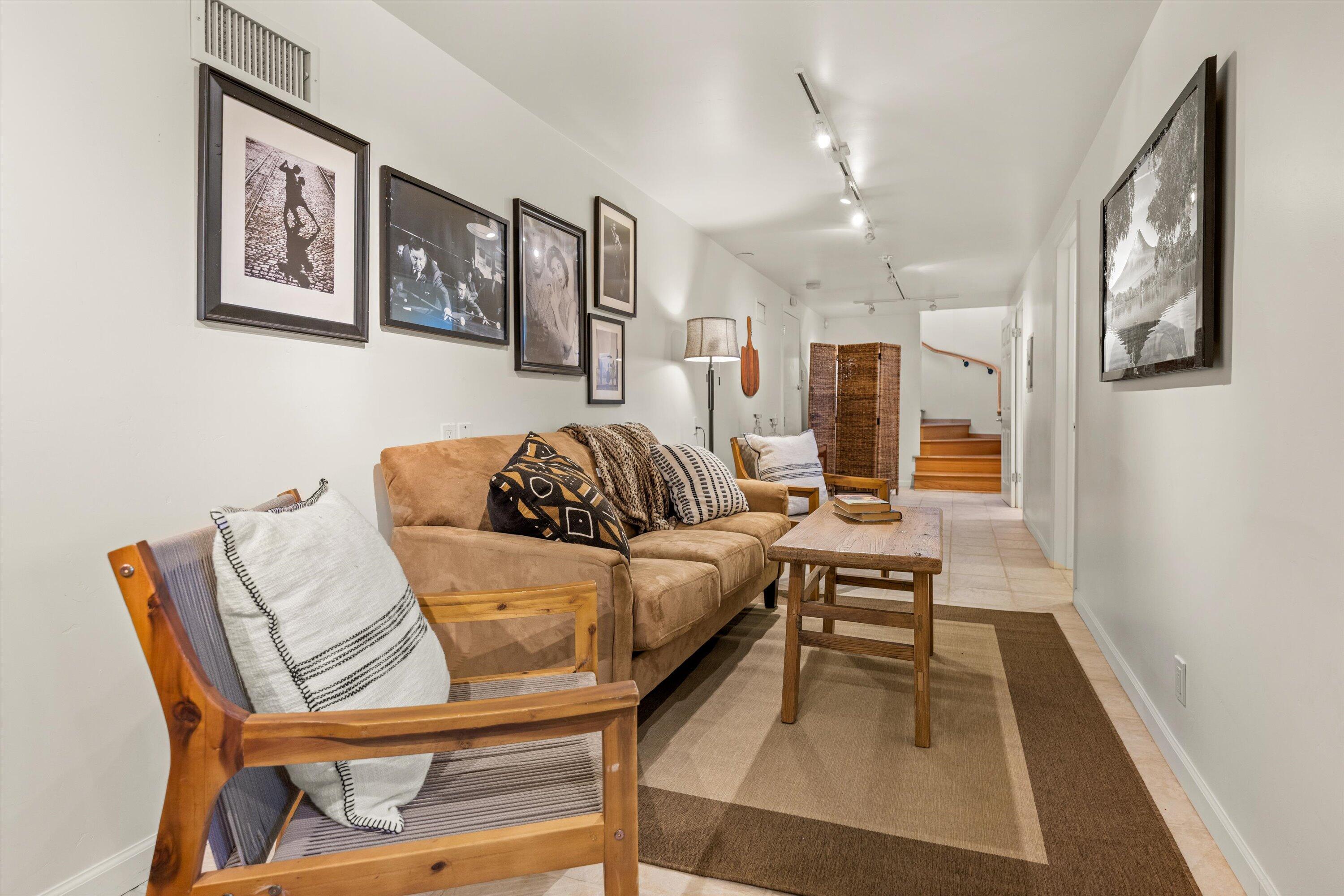 1227 Viscaino Road Santa Barbara, CA 93103 - Photo 20 of 25 a living room with furniture and a rug