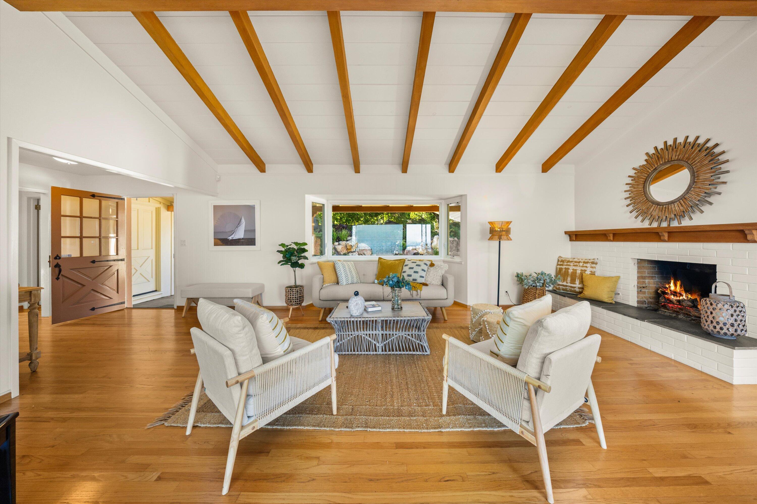 1227 Viscaino Road Santa Barbara, CA 93103 - Photo 7 of 25 a living room with fireplace furniture and a wooden floor