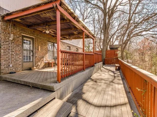 a view of balcony with wooden floor