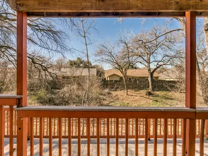 a view of a wooden street from a balcony