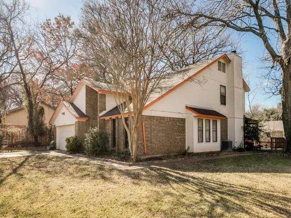 a view of a house with a yard covered in snow
