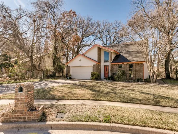 a view of a hallway with paintings on the wall