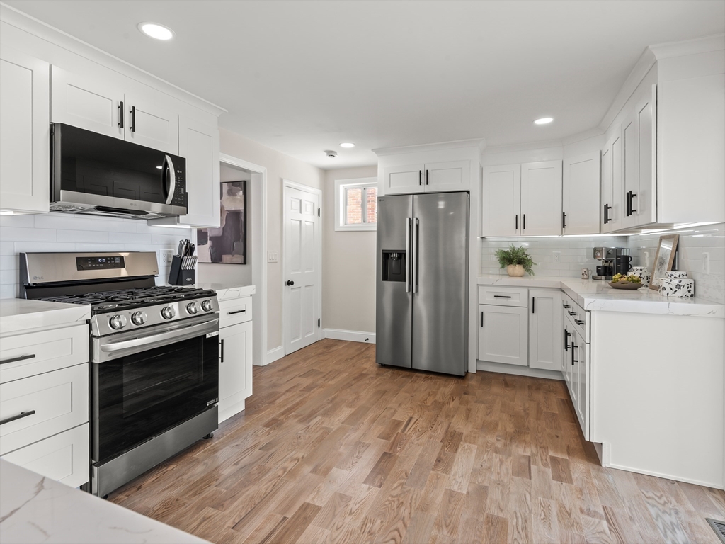 122 Copperfield Road Worcester, MA 01602 - Photo 12 of 30 a kitchen with stainless steel appliances a stove microwave and refrigerator