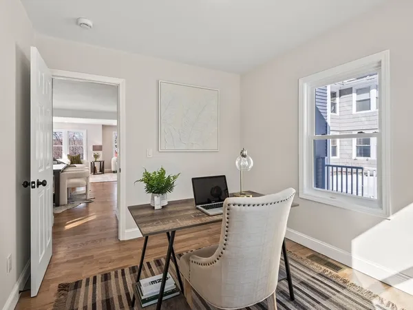 a view of a dining room with furniture window and wooden floor
