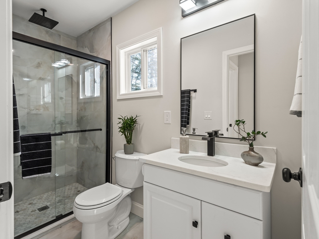 122 Copperfield Road Worcester, MA 01602 - Photo 17 of 30 a bathroom with a sink toilet and shower