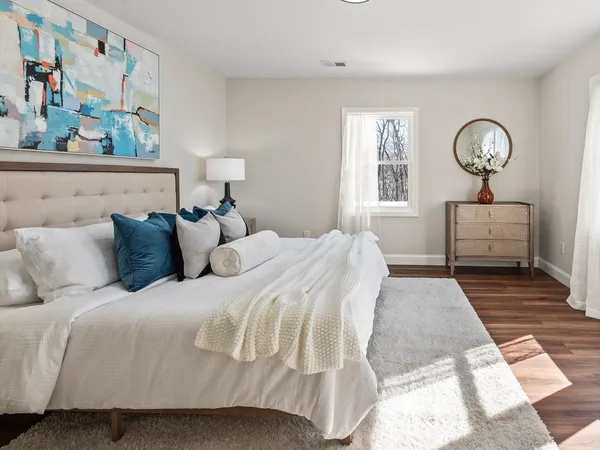 a bedroom with bed and a window