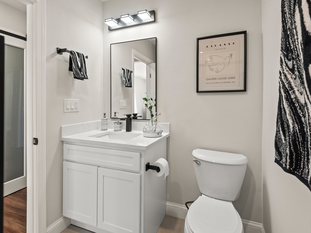 122 Copperfield Road Worcester, MA 01602 - Photo 22 of 30 a bathroom with a toilet sink and mirror