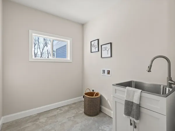 a bathroom with a granite countertop toilet a sink and bathtub